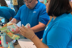 At a RARE Bears event, employees select stuffed bears in unique patterns for children with rare diseases.