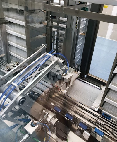 he Robocombi system mechanically picks the strips of bottlepacks from the conveyors they stand in and places them directly into the four parallel conveyor lanes leading to the packaging line.