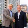Dr. Andreas Fischer, Werum IT Solutions, and Charles Mooney, Blood Centers of America, closing the agreement.