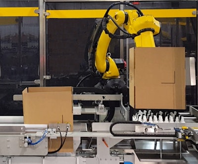 Rather than sealing the bottom, the model CEL5-BL robot holds the erected case over the load position while a servo infeed arranges the pack pattern.