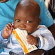 Just one box of Plumpy’Nut—containing 150 packets of a peanut-based high-energy therapeutic food that treats severe malnutrition—is enough to bring a child from the brink of death to healthy development.