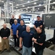 Colbert Operations Manager Jeff MacDougall (far l.), and Production Manager Pat Gibbons (lt. blue shirt) work with Colbert’s press operators on the new RMGT press.