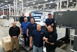Colbert Operations Manager Jeff MacDougall (far l.), and Production Manager Pat Gibbons (lt. blue shirt) work with Colbert’s press operators on the new RMGT press.