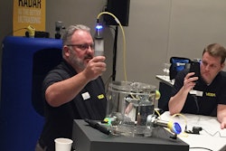 Vega’s Greg Kline demonstrates how the presence of foam can cause a color shift on the company’s 360-degree color display, making it easy to see when the status has changed.