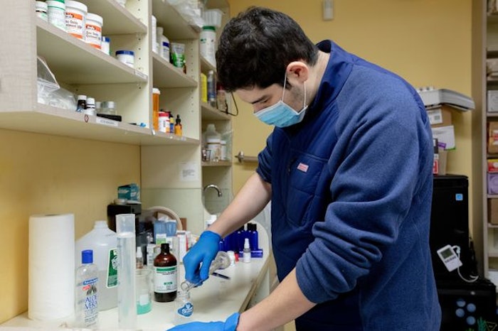 Mixing hand sanitizer.