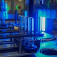 Automated transfer station of product into coating machine