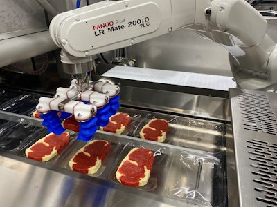 Quest developed a flexible robotic system to load meat and poultry into an Ossid ReeForm E40 thermoformer.