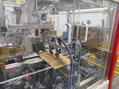 Shown here are hot melt adhesive dispensers that are part of the wraparound case packers.