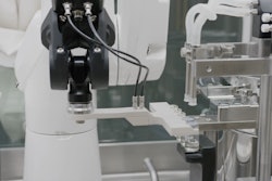 A Stäubli TX2 series Stericlean robot presents vials for secure stoppering with reliable repeatability and no risk to the aseptic environment.