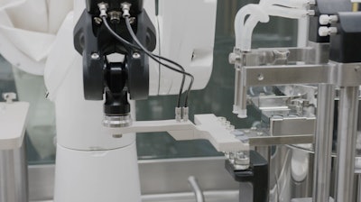 A Stäubli TX2 series Stericlean robot presents vials for secure stoppering with reliable repeatability and no risk to the aseptic environment.