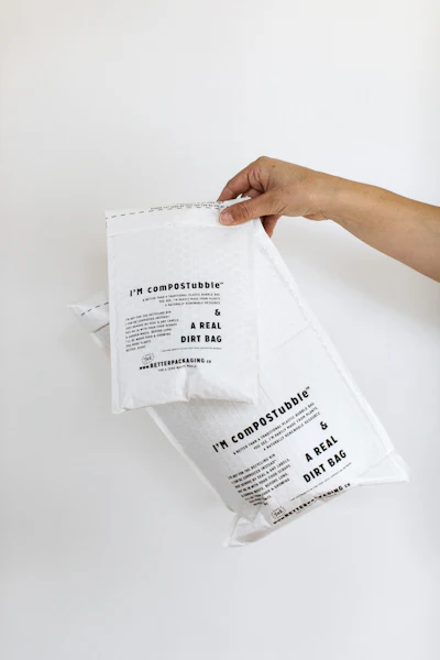 Glass bottles and jars are placed in comPOSTubble compostable bubble mailers before being packed into compost packs, for extra protection against damage.