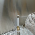 A technician working on the Mars 2020 Perseverance rover mission takes a sample from the surface of sample tube 241 to test for contamination. Each sample tube has its own unique serial number (seen on the gold-colored portion of the tube). The image was taken in a clean room facility at NASA's Jet Propulsion Laboratory in Southern California, where the tubes were developed and assembled.