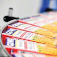 Goya Foods packages beans, rice mixes, corn meal, and other dry products at its new facility in Secaucus, N.J. Pictured here, filled and sealed packages of Spanish rice proceed to a cartoning line.