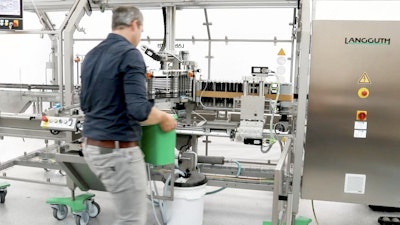 In this new Langguth development, a simple bucket can be placed into the machine to soak the whole gluing unit overnight, leaving it ready to seamlessly restart production the next day.