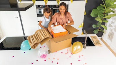 Waved paper pads serve both as blocking and bracing for a delicate carton board cake box, and insulation to keep things cool.