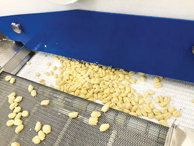 Pierino gnocchi enter a Messer Wave Impingement Freezer.