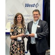 West team member Kate Giannantonio accepts award from INTERPHEX representative on behalf of West