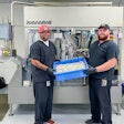 John Lamm, Juana Roll Technician Lead (left), and Elijah Streadwick, Assistant Manager (right), both of NGW, with product in front of the JuanaRoll eight-channel automatic pre-roll machine, available in models with from one to eight channels.