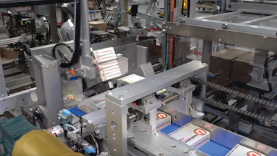 Cartons are formatted to 2x5 stacks, then oriented by turning 90 deg on-edge, prior to three-sided containment and a pusher loading them into a corrugated case.