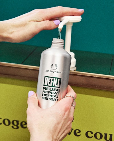 The reusable bottles are refilled by store clerks from a behind-the-counter refill station.