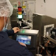 Mechanic using HMI to setup a VJ 1280.