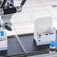 Labeled vials are loaded into cartons.
