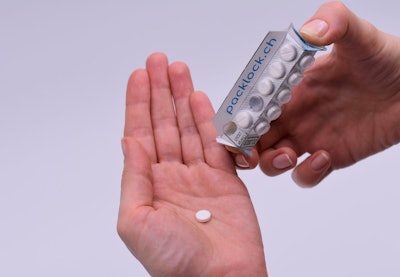 Applying pressure to the Packlock blister card and creating the rectangular prism is required to open up a space between the backing of the card, allowing the user to push a pill into the space and have the pill drop down.