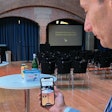 Stahel demonstrates Zapvision at his booth at AIPIA. The system allows a smartphone to read an on-pack QR code at a distance. For a user with sight limitation, more information becomes available on the screen—in large text or with audio—as he or she moves closer to a product on the shelf.