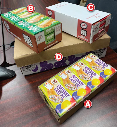 All four of these corrugated formats are handled on the tri-functional robotic cell: 8-count open tray (A), 12-count open tray (B), 12-count comb-over (C), and 48-count tray with lid (D).