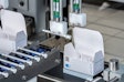 In Lundbeck's operation, a robot picks up one pipette for each carton of vials.