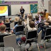 Kevin Pittner teaches second- and third-grade students about the lifecycle of trees.