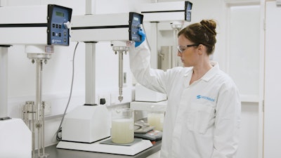 Modern tabletop processing equipment gives R&D teams unprecedented control over formulations before scaling up. Here, a food technician creates a small batch of guar gum.
