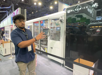 Kiran Shibu, R&D quality engineer at Packsize, demonstrates the X5 Nozomi at drupa.