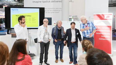 Uwe Melichar (second from right) of the European Brand and Packaging Design Association, curated the private brand owner tour of drupa for Touchpoint Packaging, a pavilion and topical packaging hub of the show.