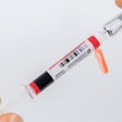 The security seal integrated in the needle protection system is automatically activated when pulling off the syringe cap and irreversibly indicates the first opening.