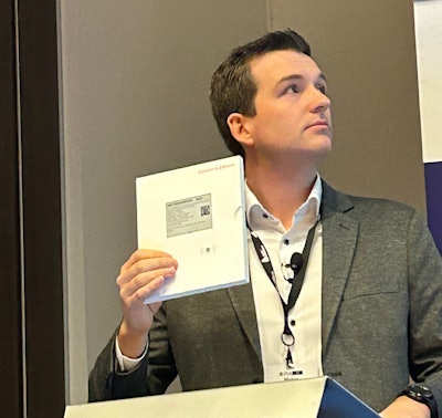 Pieter Piron holds up an example of a how a digital display label will be used on packages containing drugs for clinical trials.