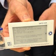 A prototype of a digital display label attached to a vial containing a drug for a clinical trial.
