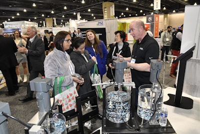 Attendees and Exhibitor interact at PACK EXPO East 2024