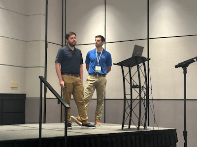 Grantek's Dylan De Anna (left), accompanied by George Kokkinias, Grantek Operations Manager (right), shared the benefits and current hurdles to overcome in integrating AI in CIP processes.