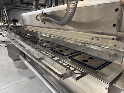One of the many MAP tray sealing systems built by Orics over the years.