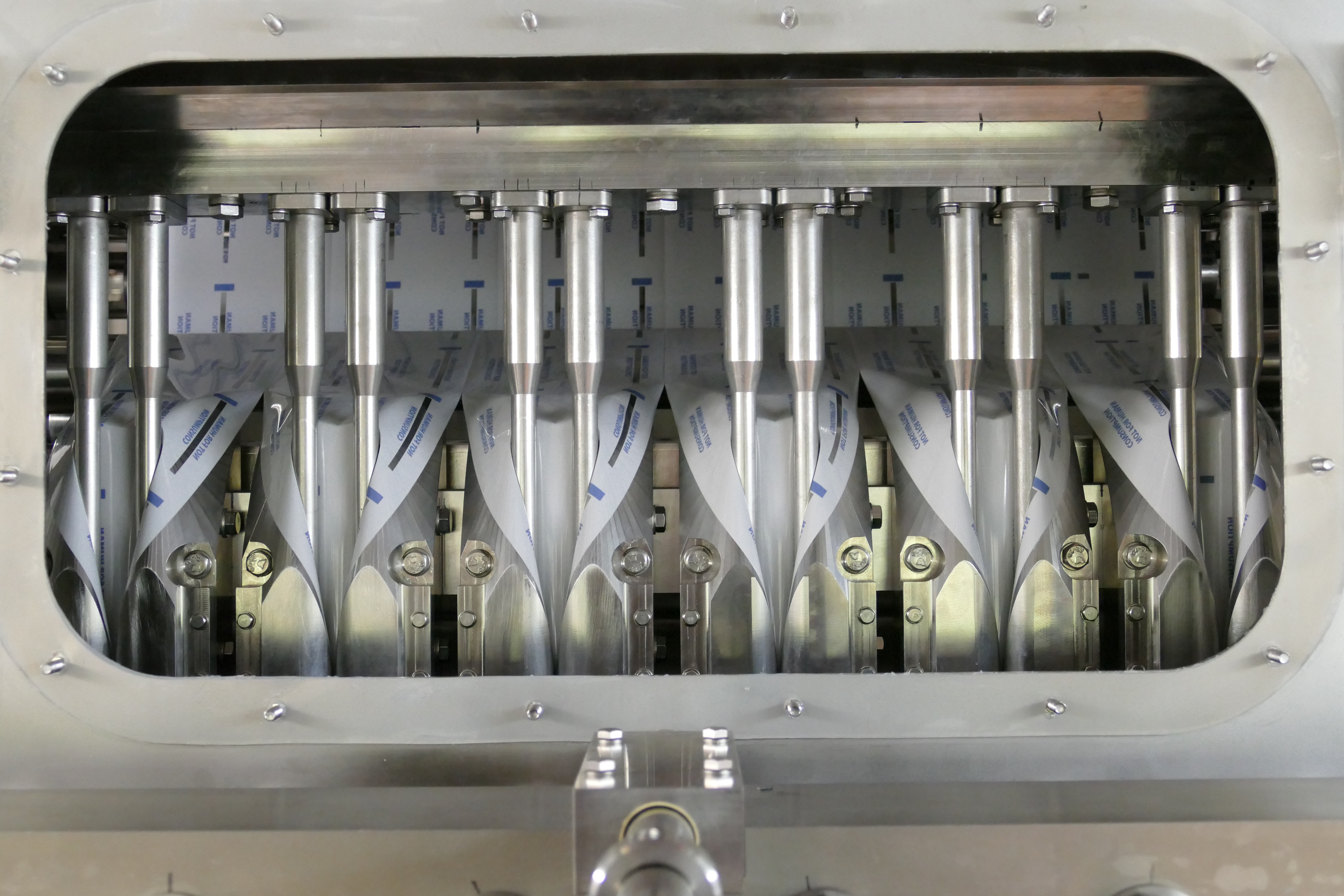 Precision industrial machinery with multiple vertical metallic components in a technical assembly