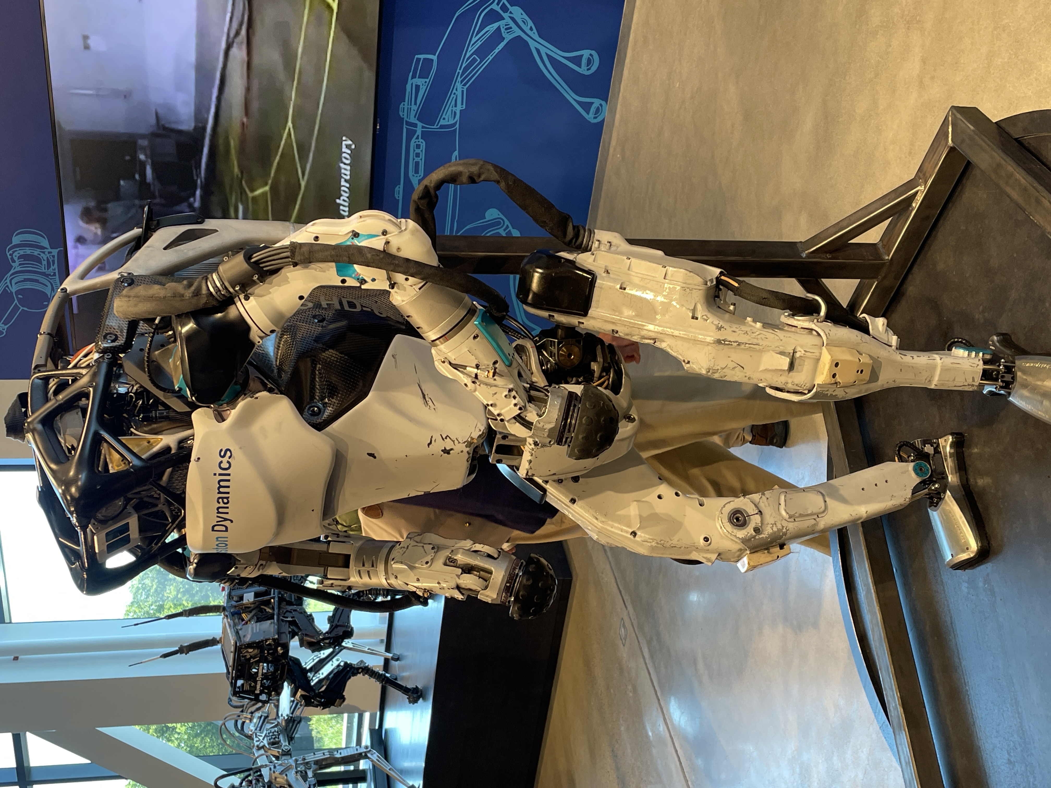 Advanced humanoid robot with white and metallic body standing in laboratory