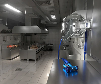 Commercial kitchen with stainless steel equipment and blue robotic cleaning device