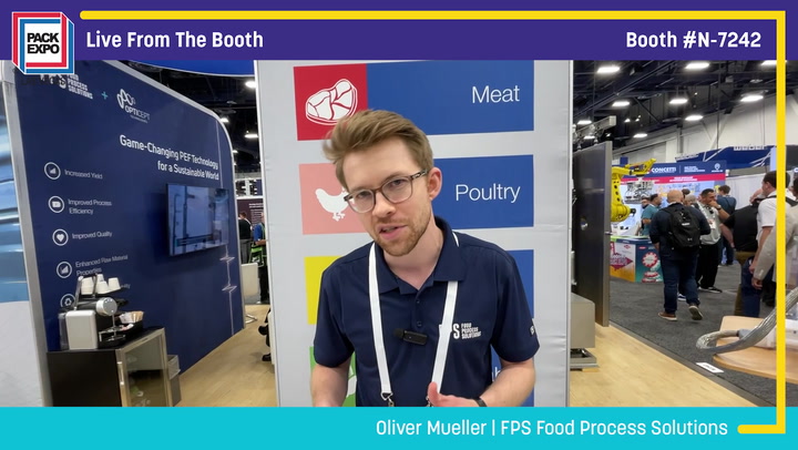 Trade show booth representative at Pack Expo discussing food processing solutions