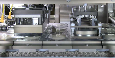 Industrial packaging machine with mechanical components and conveyor chain