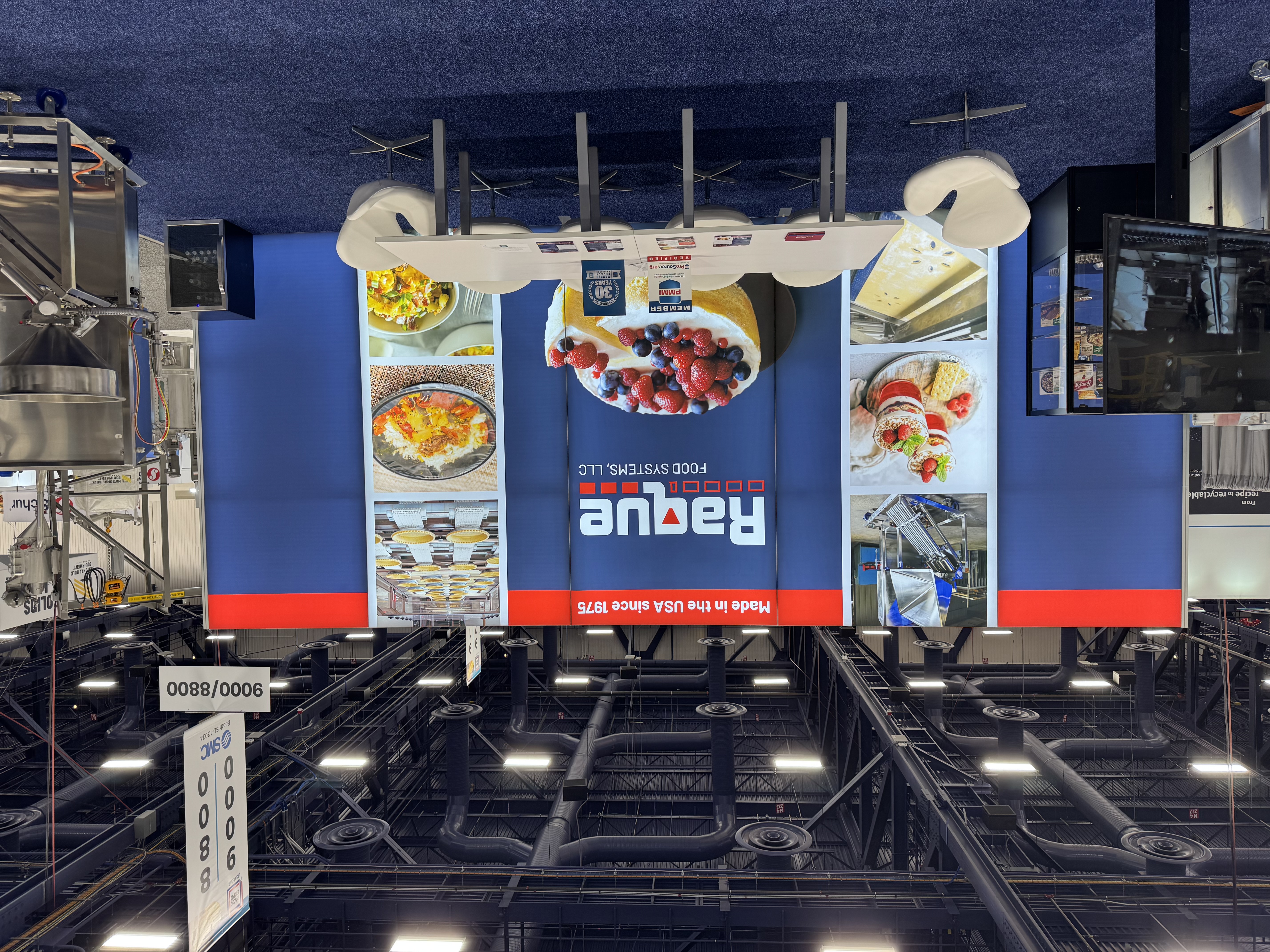 Rogue Food Systems trade show booth with food product displays and equipment