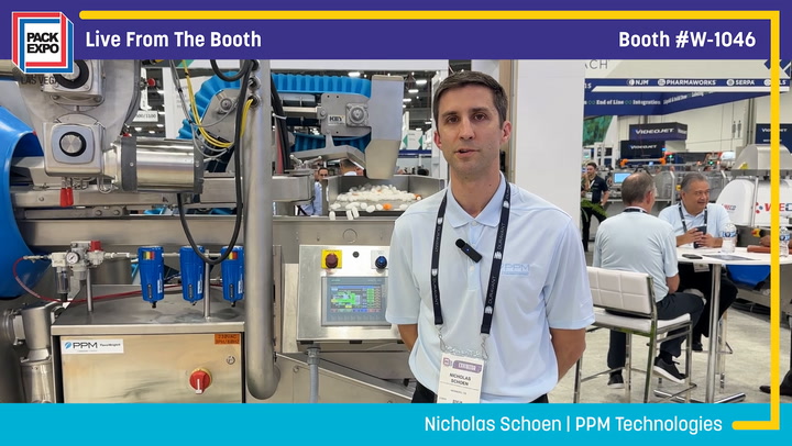 Trade show booth with industrial packaging machinery and technical representative