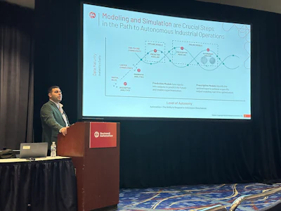 Presenter discussing autonomous industrial operations at Rockwell Automation conference