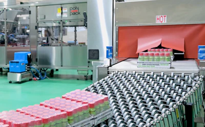 Shown here are shrink-wrapped trays exiting the shrink tunnel.