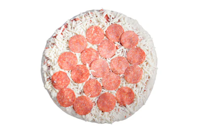 Uncooked pepperoni pizza with white cheese and red pepperoni rounds